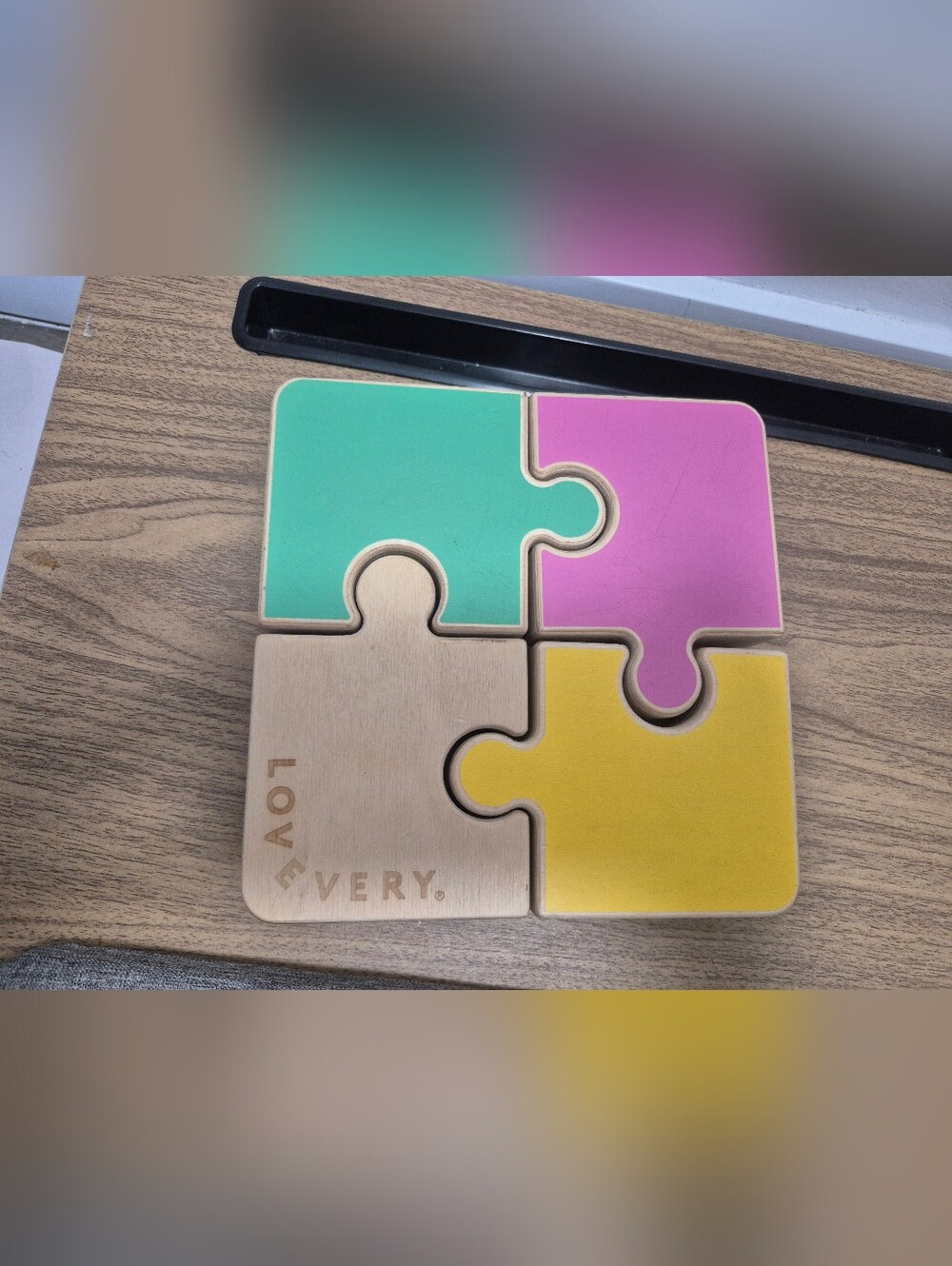 Lovevery Chunky Wooden Jigsaw Puzzle featuring reversible pastelpieces.